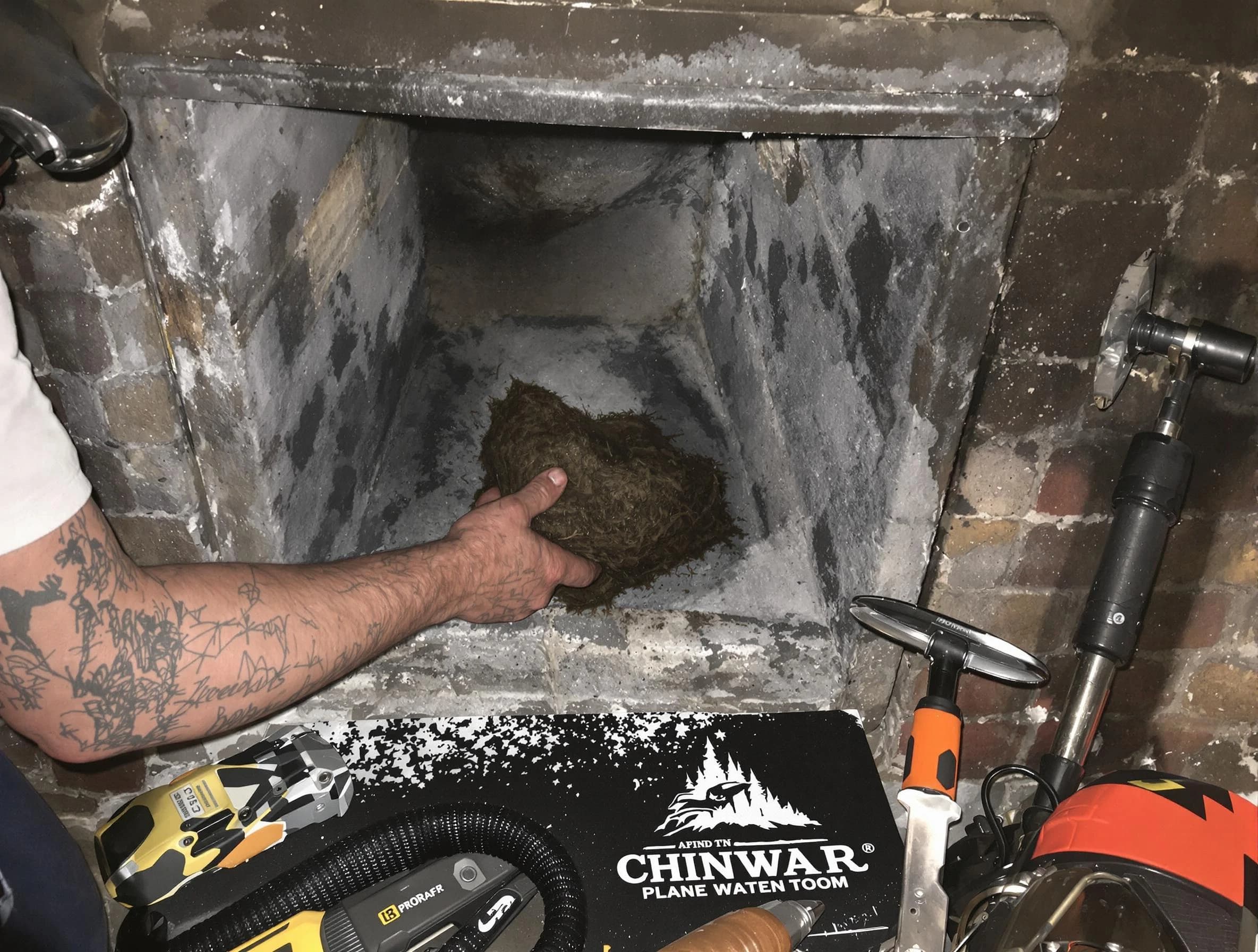 Louisville Chimney Sweep safely removing debris and screening chimney in Louisville, CO